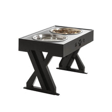 Last inn bildet i Galleri-visningsprogrammet, Stylish black pet feeding station with two stainless steel bowls, featuring paw print design and a sturdy X-shaped support that can be adjusted according to the pet's growth